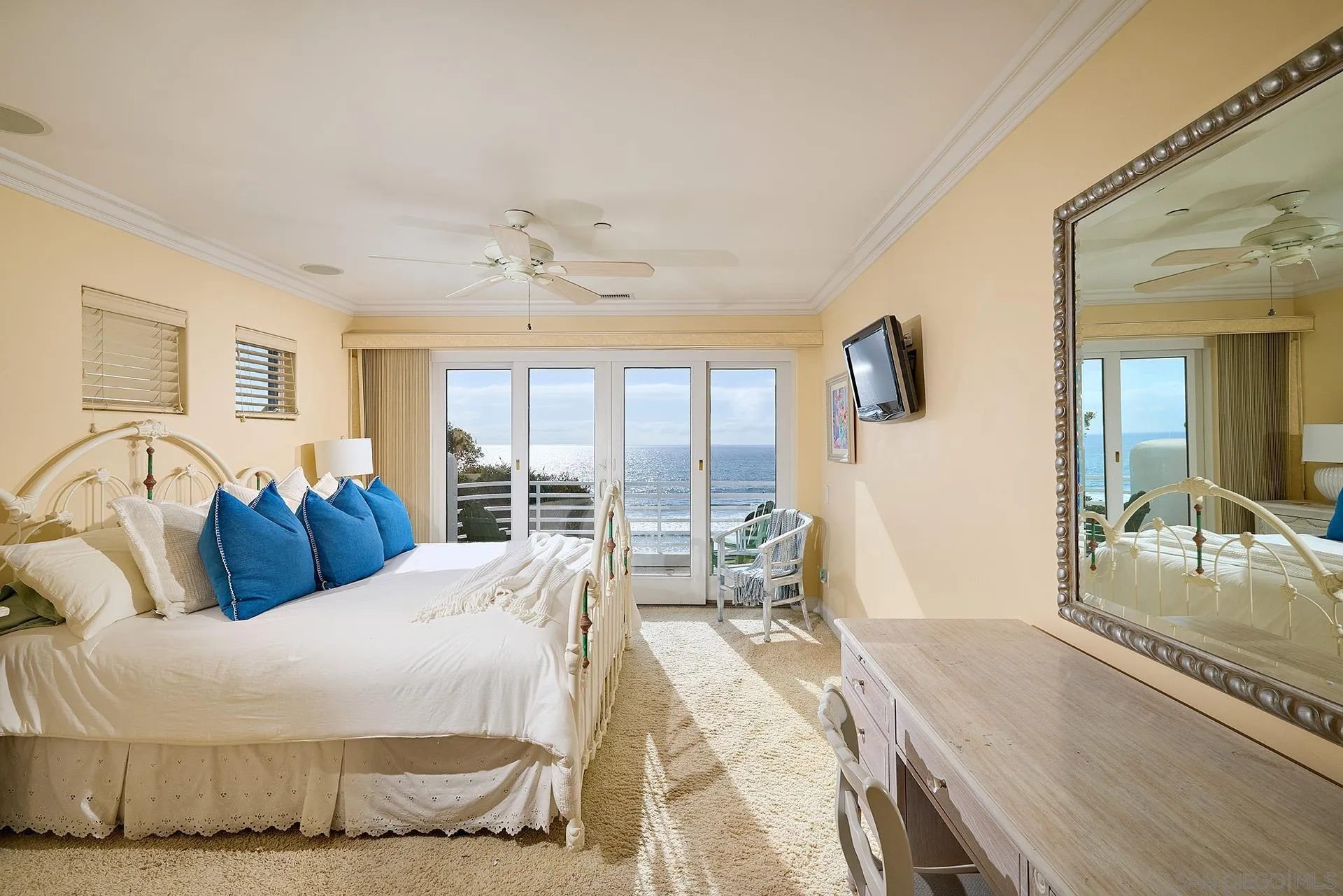 1630 Neptune Avenue Encinitas, CA 92024 - Photo 12 of 25 a bedroom with a large bed and a large window
