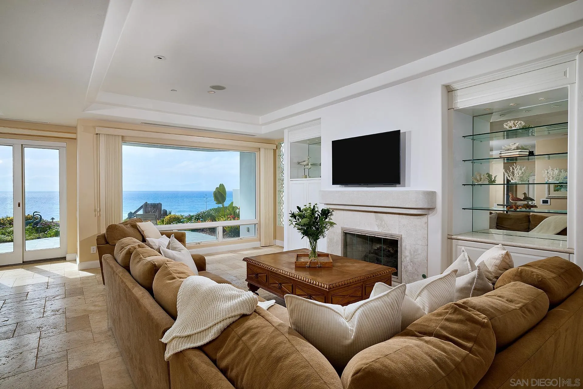 1630 Neptune Avenue Encinitas, CA 92024 - Photo 3 of 25 a living room with furniture a fireplace and a flat screen tv
