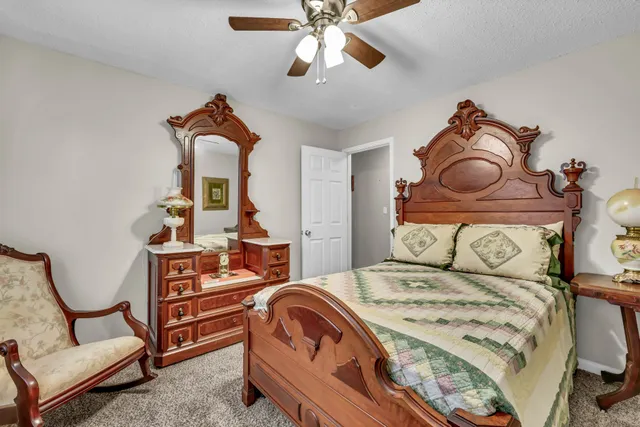 a bedroom with furniture and natural light