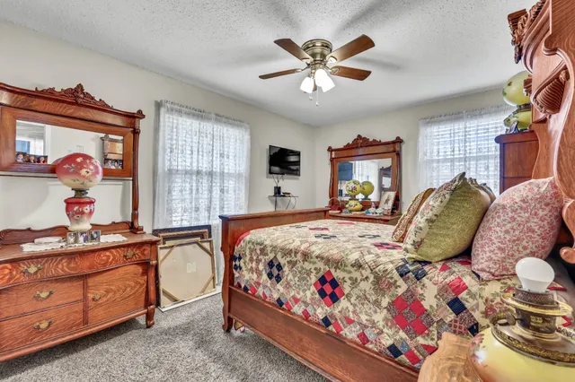 a bed room with a bed and a chandelier
