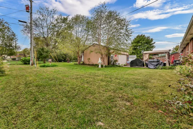 a view of a house with a yard porch and sitting area