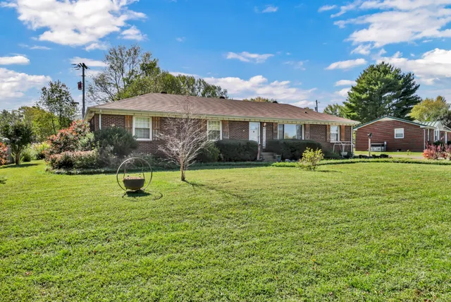 a view of a house with a big yard