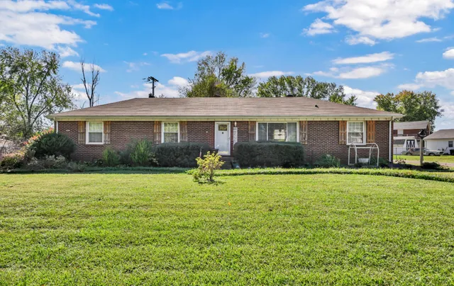 a view of a house with a big yard