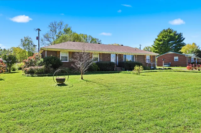 a view of a house with a yard porch and sitting area
