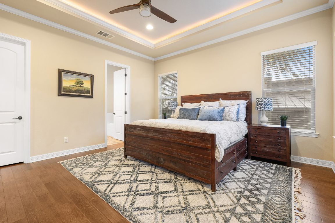 103 Kendall Road Spicewood, TX 78669 - Photo 17 of 37 a bedroom with a bed and a window