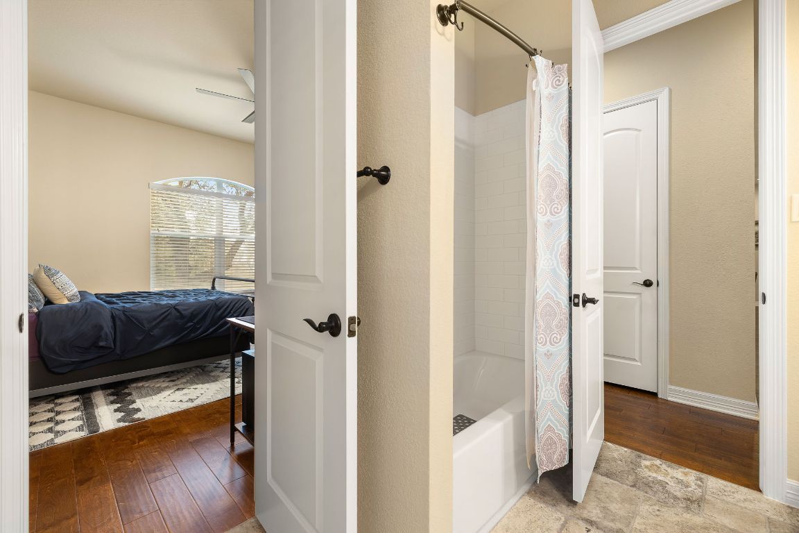 103 Kendall Road Spicewood, TX 78669 - Photo 24 of 37 a living room with furniture and a wooden floor
