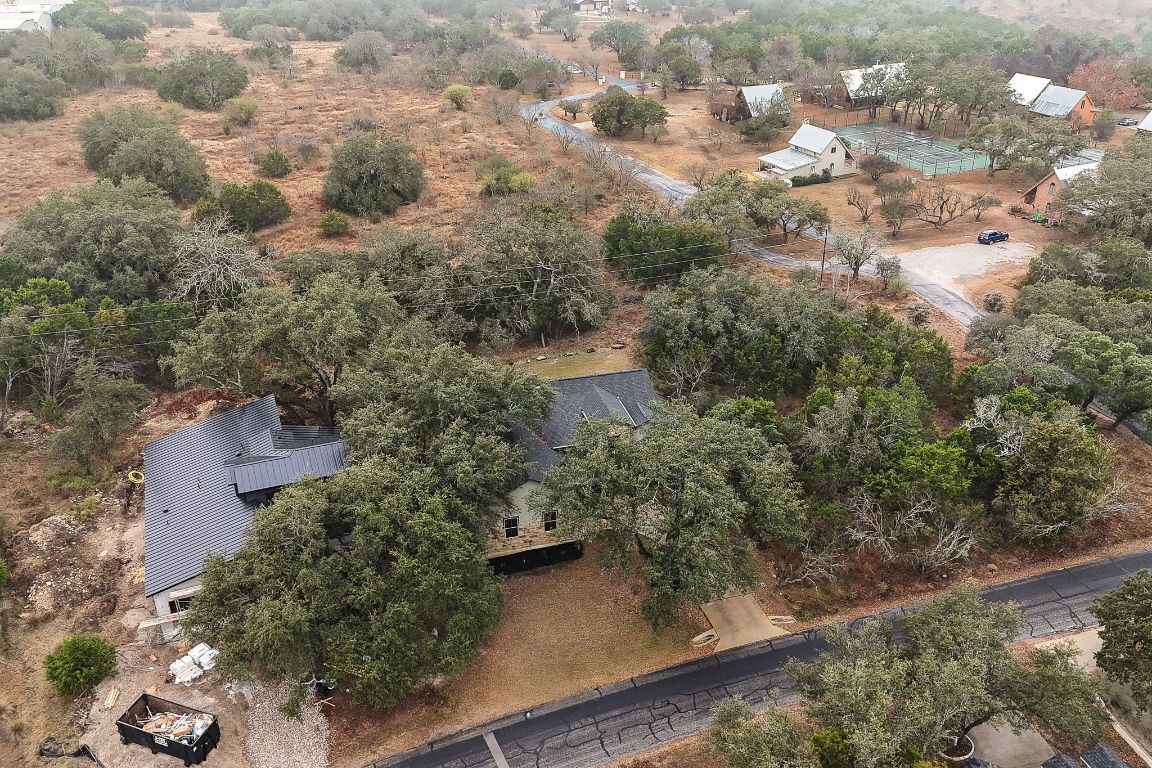 103 Kendall Road Spicewood, TX 78669 - Photo 33 of 37 a view of a house with a yard