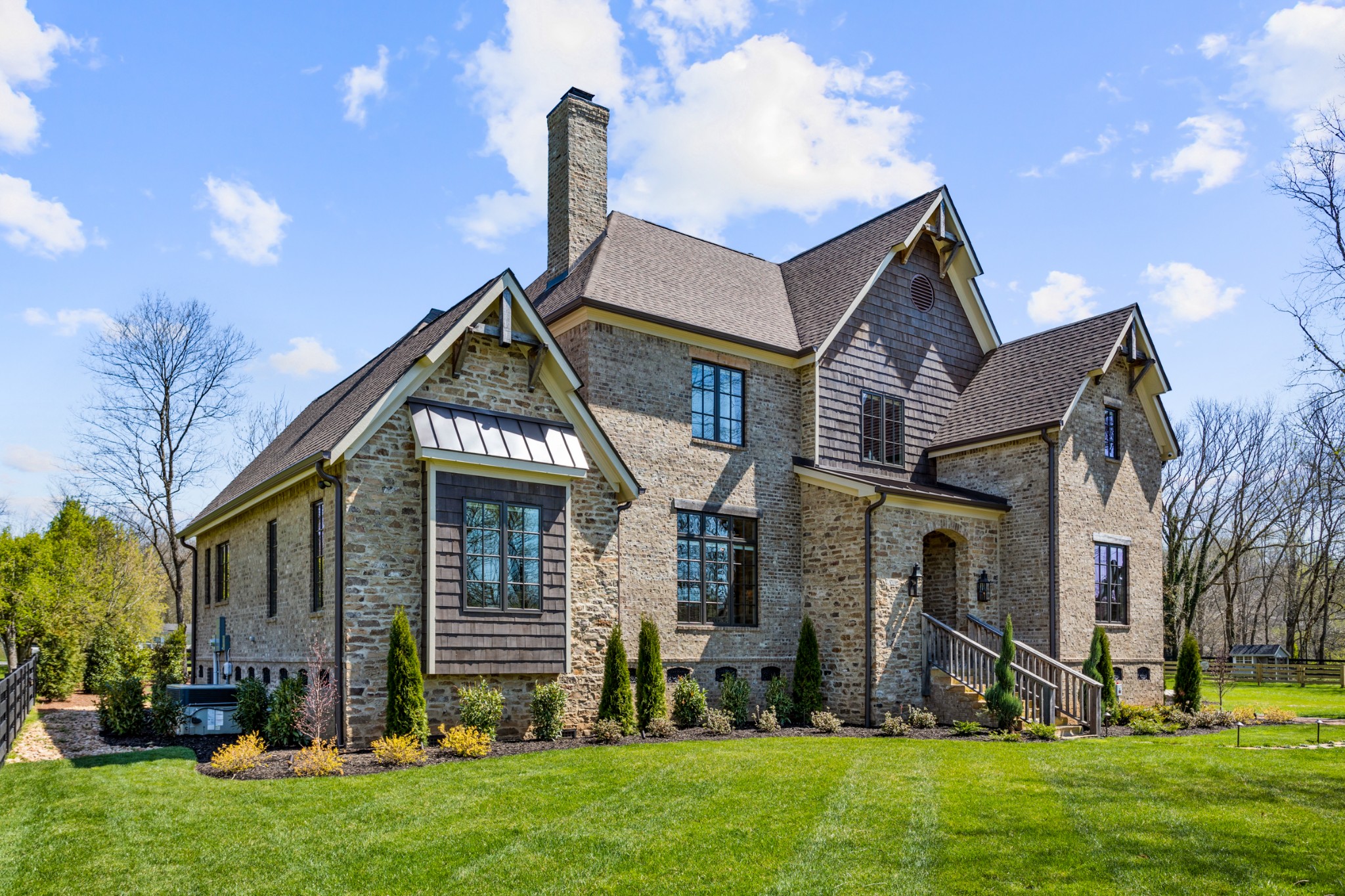 3330 Bailey Road Franklin, TN 37064 - Photo 2 of 37 a front view of a house with a garden and plants