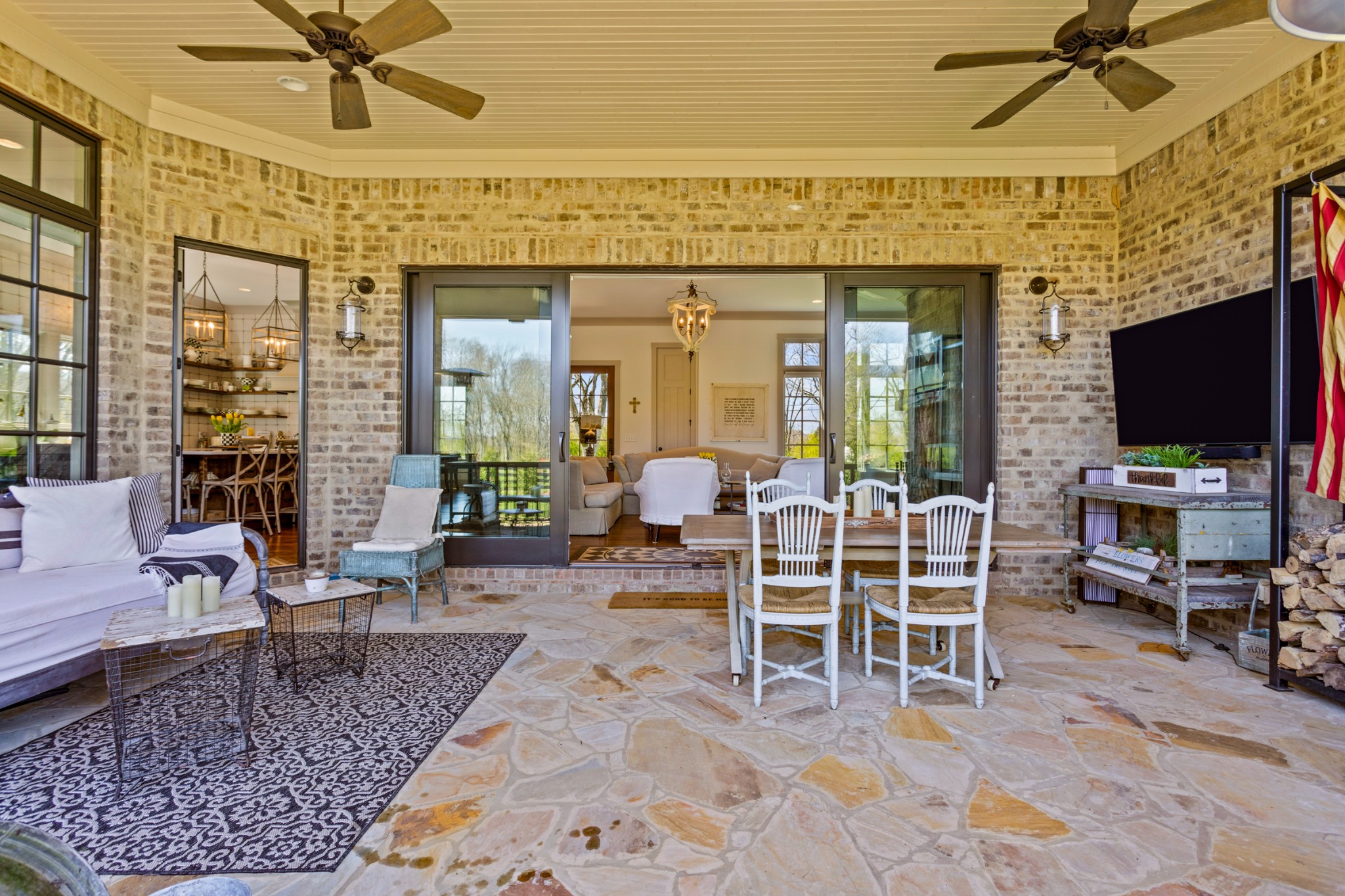 3330 Bailey Road Franklin, TN 37064 - Photo 23 of 37 a living room with furniture a flat screen tv and floor to ceiling window