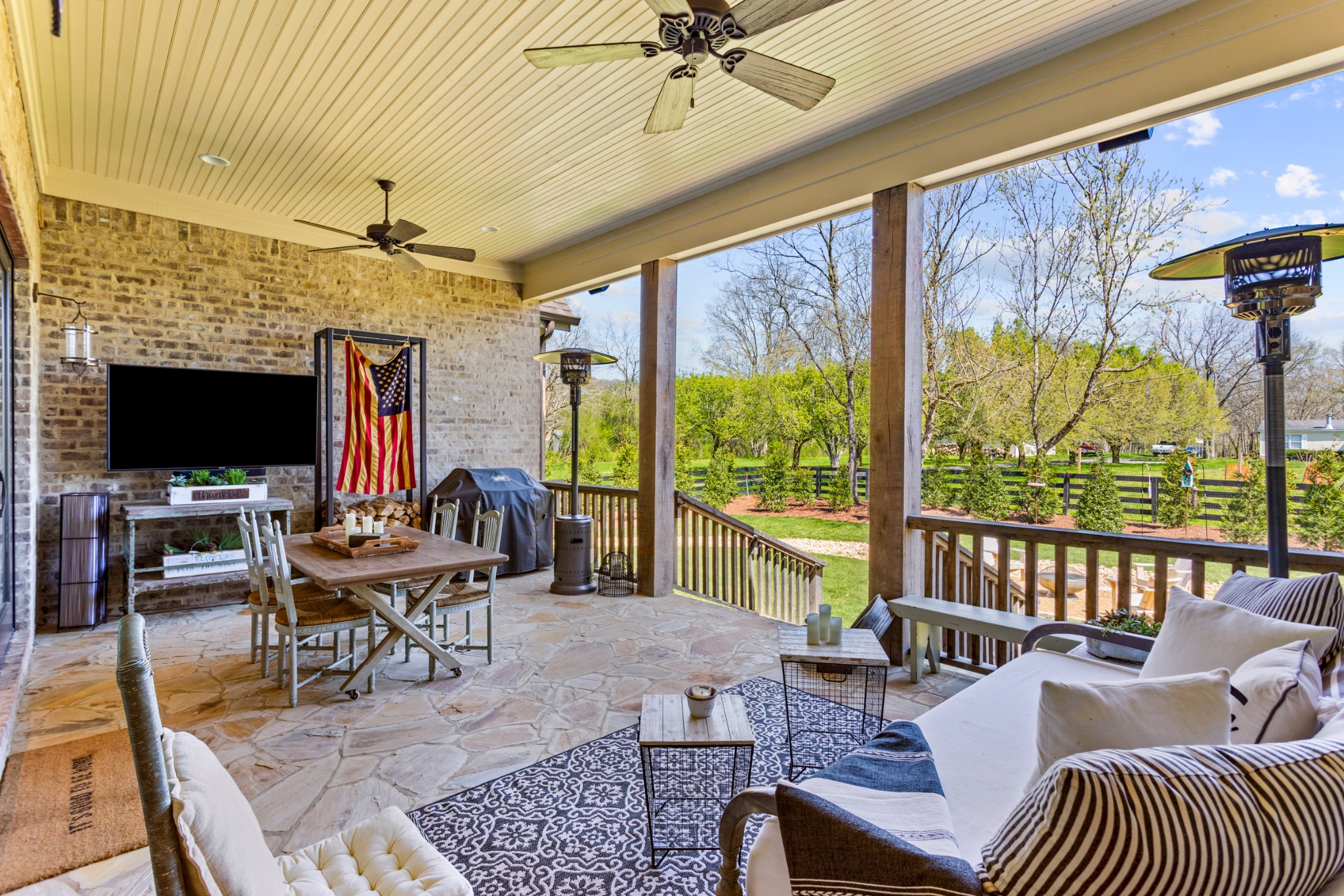 3330 Bailey Road Franklin, TN 37064 - Photo 24 of 37 a living room with furniture a flat screen tv and a floor to ceiling window