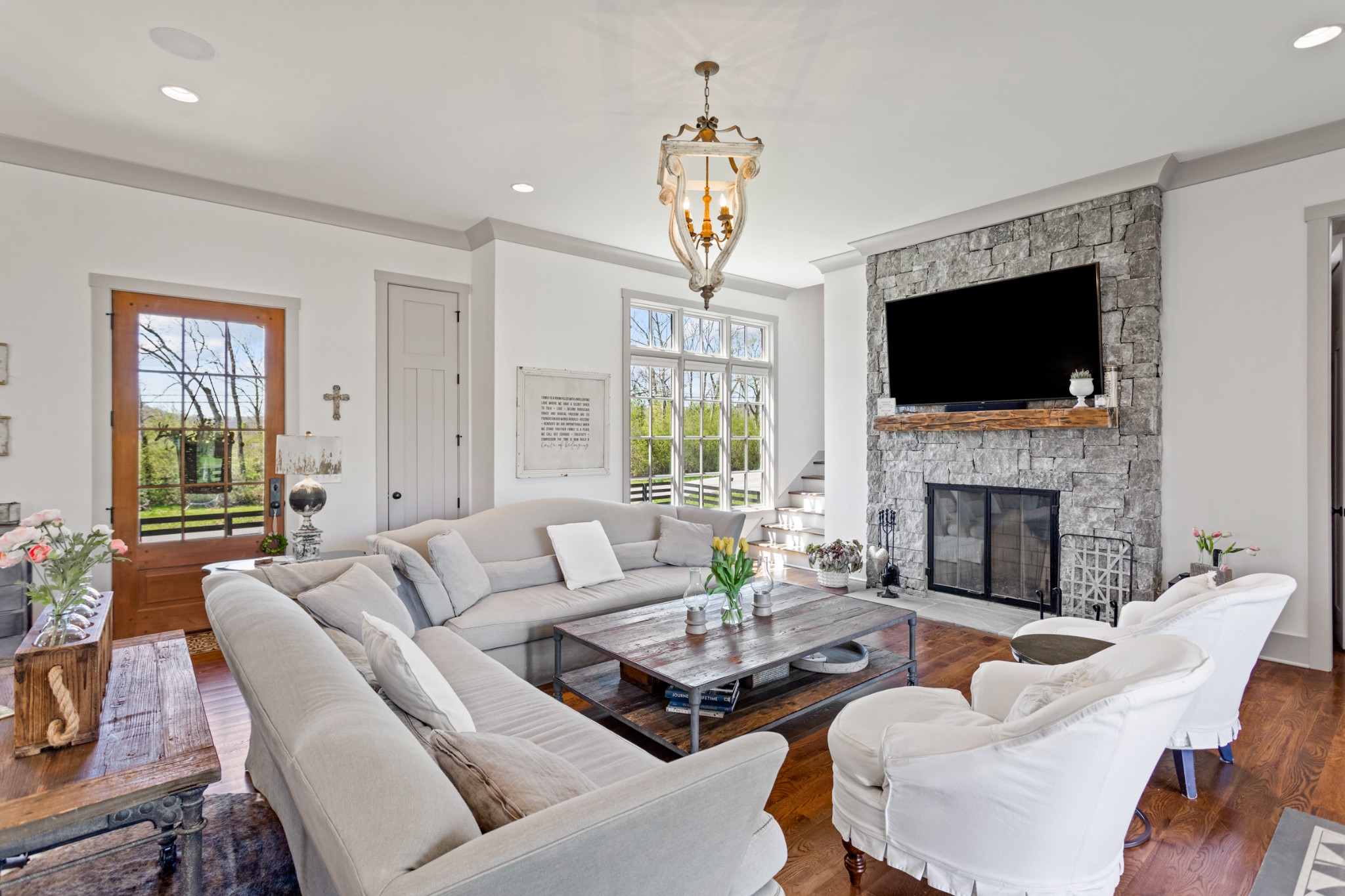 3330 Bailey Road Franklin, TN 37064 - Photo 6 of 37 a living room with furniture a fireplace and a flat screen tv