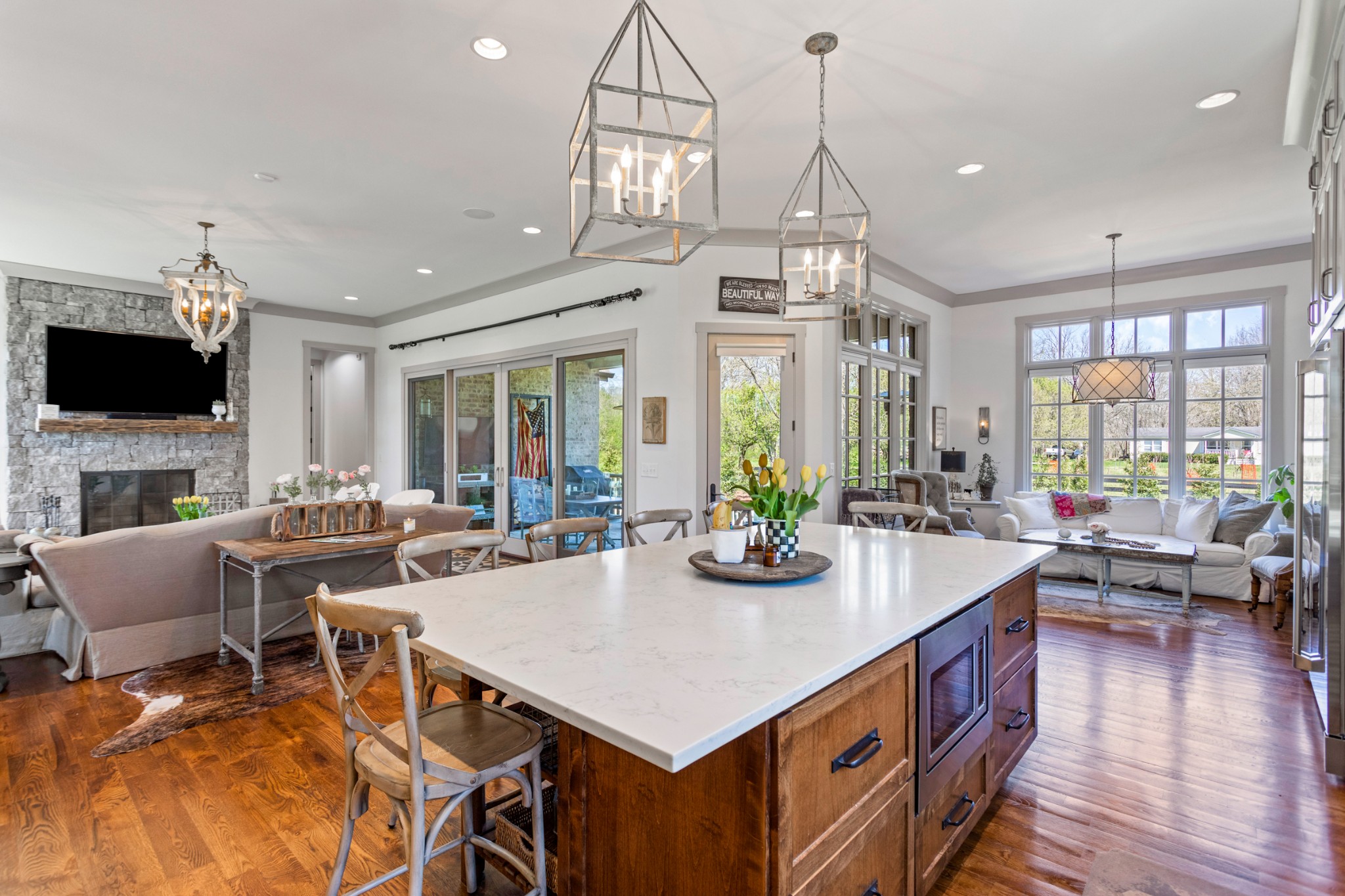 3330 Bailey Road Franklin, TN 37064 - Photo 9 of 37 a view of a dining room and livingroom with furniture wooden floor a chandelier