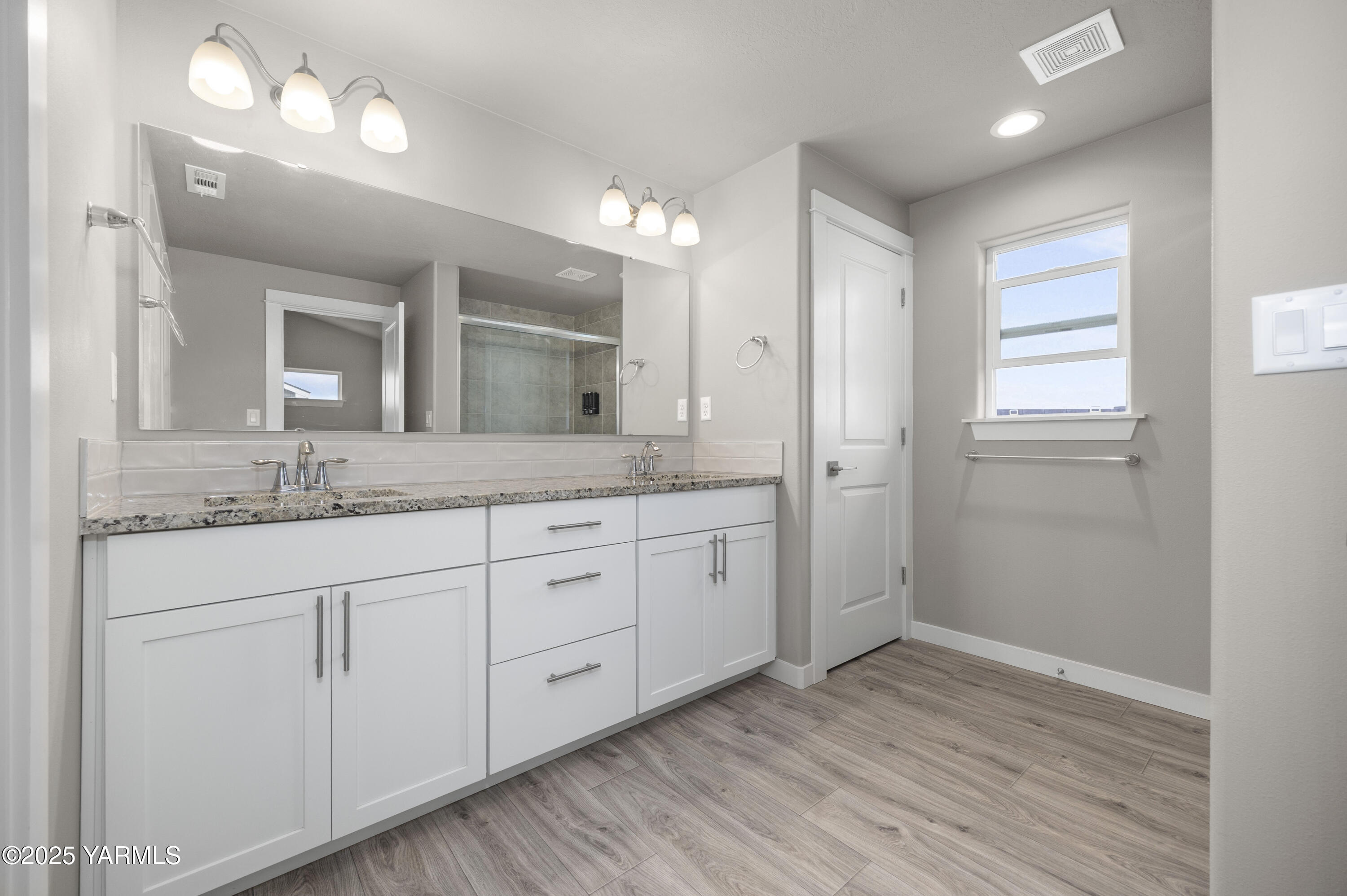 217 Rio Bravo Street Prosser, WA 99350 - Photo 17 of 44 a bathroom with a granite countertop double vanity sink and mirror