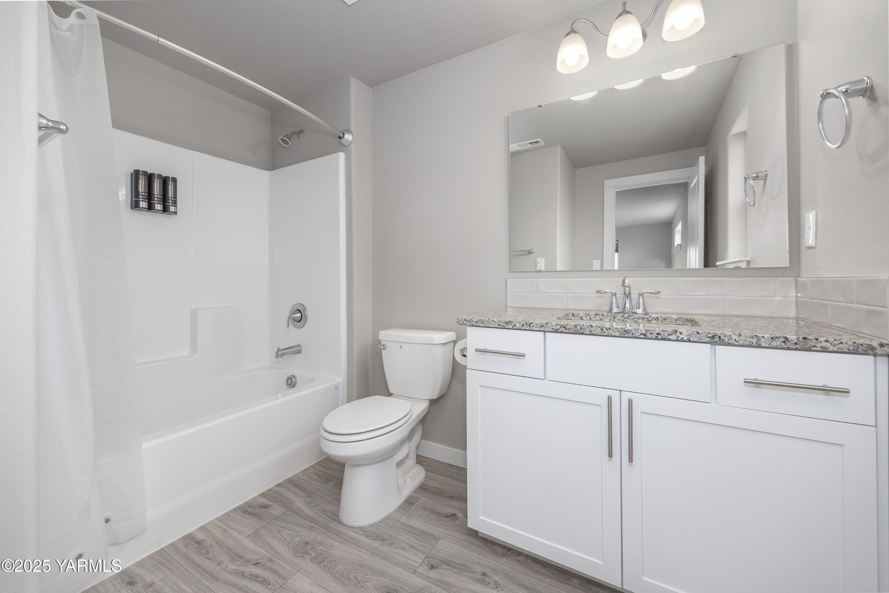 217 Rio Bravo Street Prosser, WA 99350 - Photo 22 of 44 a bathroom with a sink toilet a mirror and shower