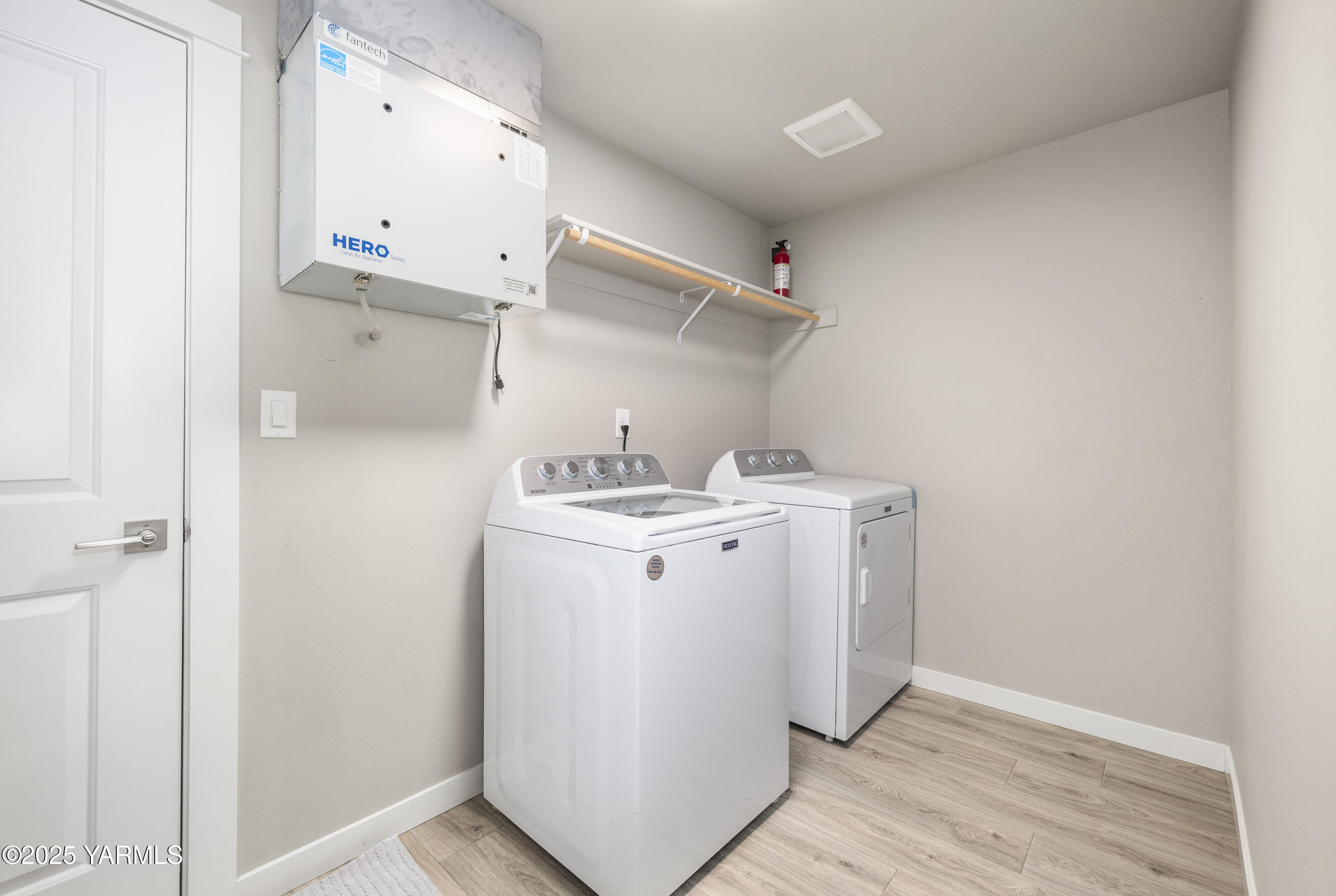 217 Rio Bravo Street Prosser, WA 99350 - Photo 26 of 44 a utility room with cabinets washer and dryer