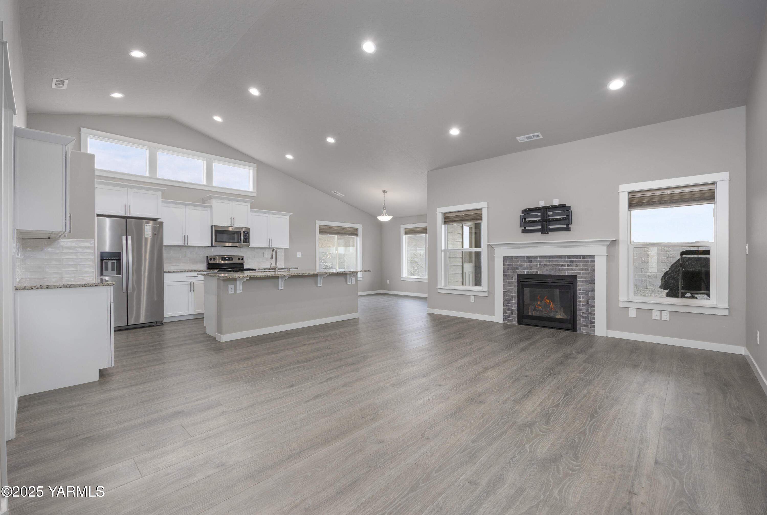217 Rio Bravo Street Prosser, WA 99350 - Photo 6 of 44 a view of kitchen with cabinets and wooden floor