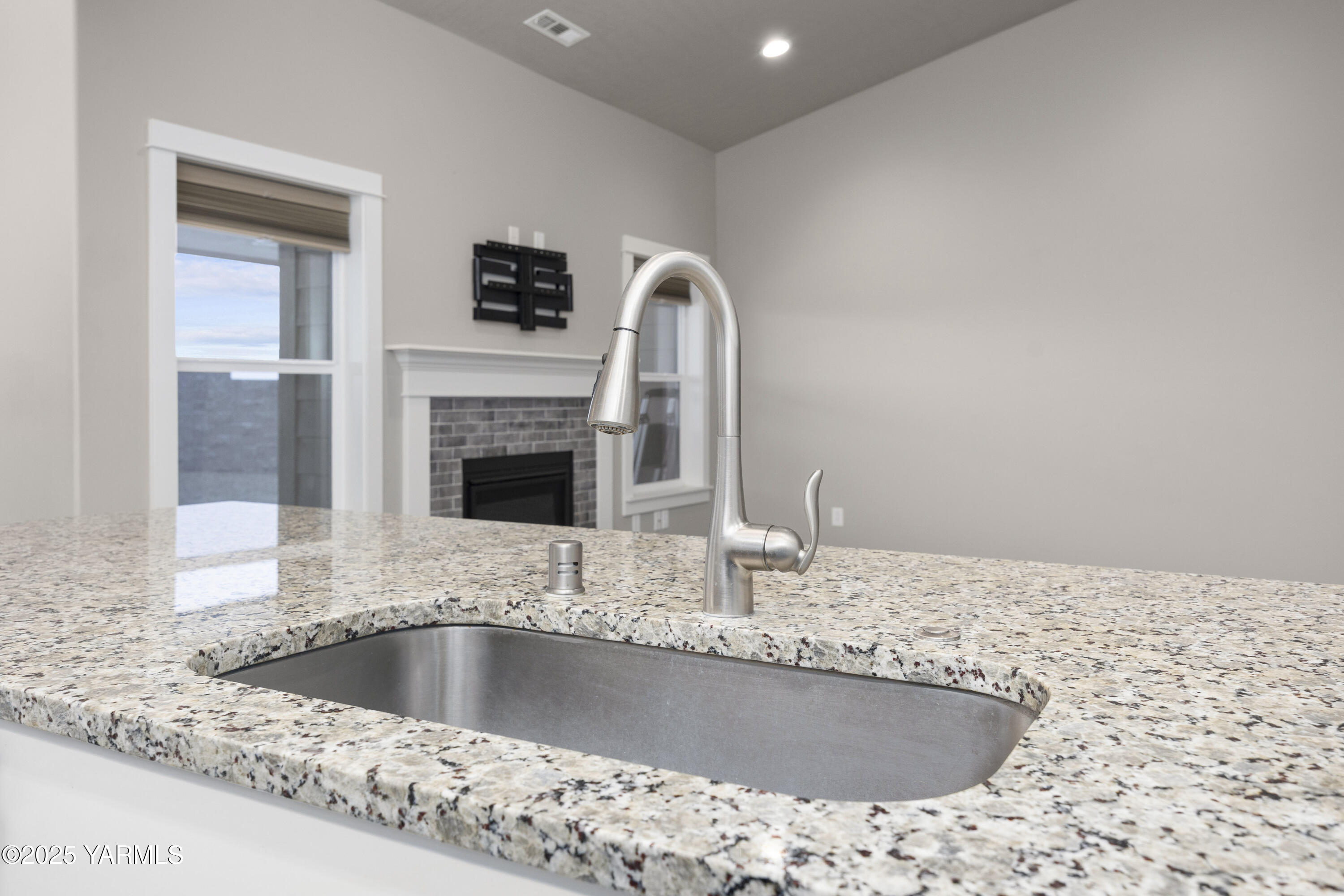 217 Rio Bravo Street Prosser, WA 99350 - Photo 9 of 44 a kitchen with a sink and a stove top oven