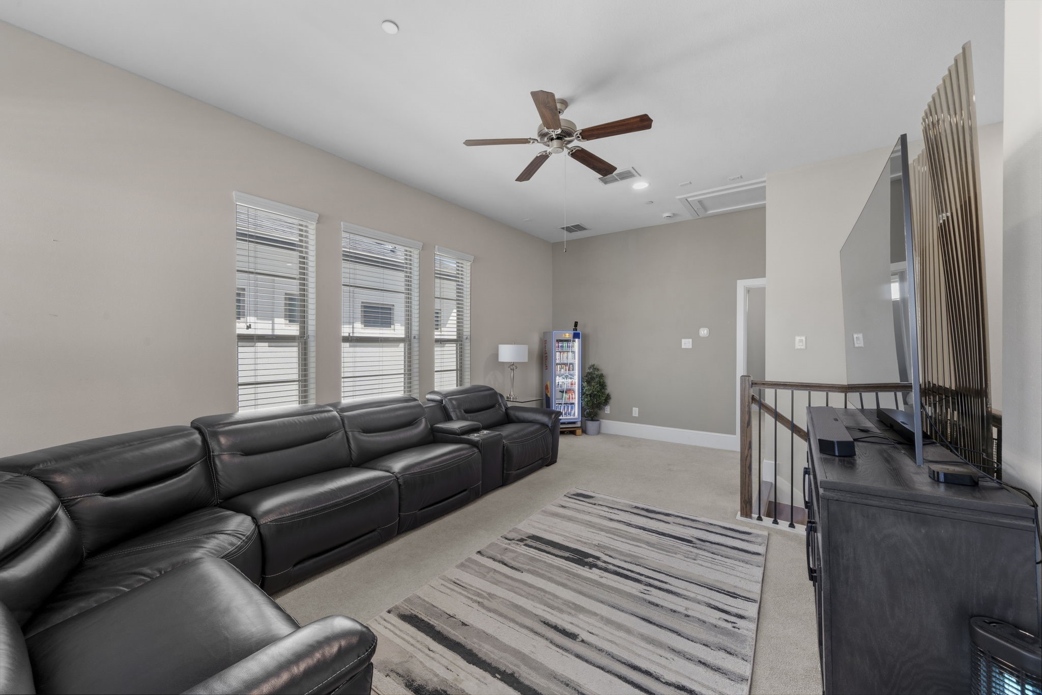 5467 Larkin Street Houston, TX 77007 - Photo 24 of 33 a spacious bedroom with a bed a couch and a window