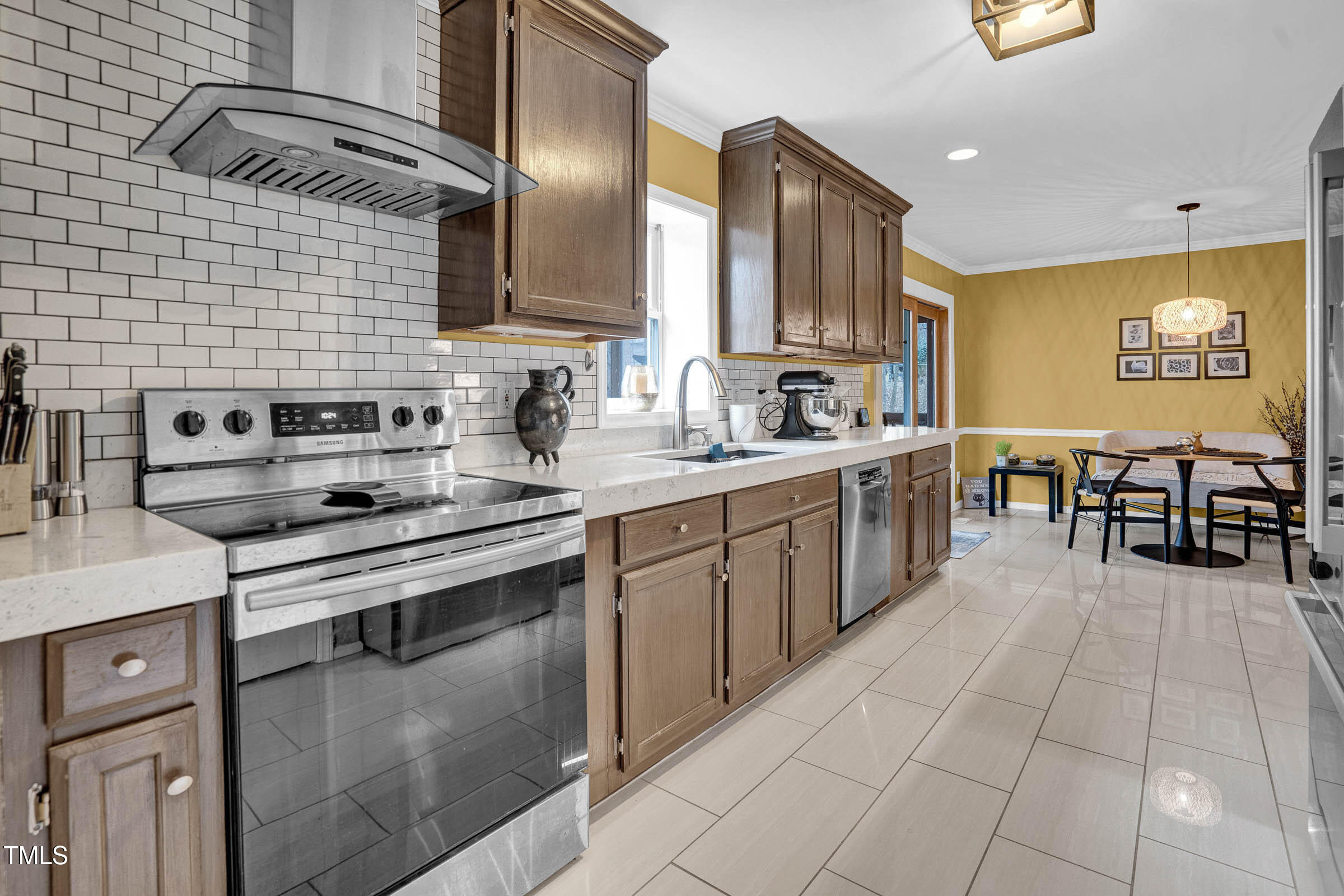 3312 Powers Lane Durham, NC 27712 - Photo 8 of 28 a kitchen with a sink a counter top space cabinets and stainless steel appliances