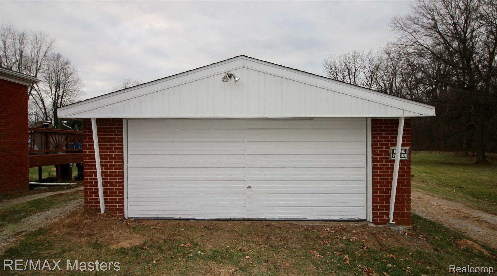 12527 Sumpter Road Carleton, MI 48117 - Photo 3 of 33 The 2 car detached garage sits alongside the home.