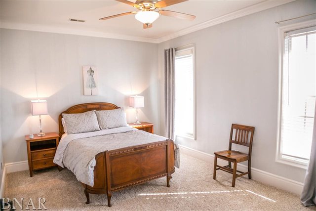 21192 North 500th Road East Benson, IL 61516 - Photo 18 of 30 a bedroom with a bed and a lamp