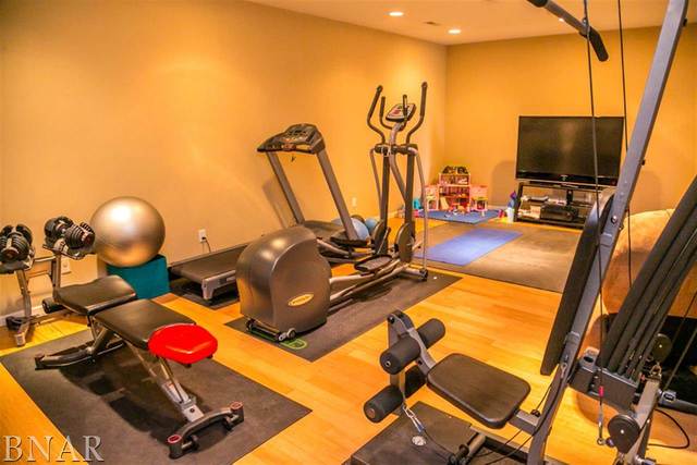21192 North 500th Road East Benson, IL 61516 - Photo 24 of 30 a room with gym equipment and a flat screen tv