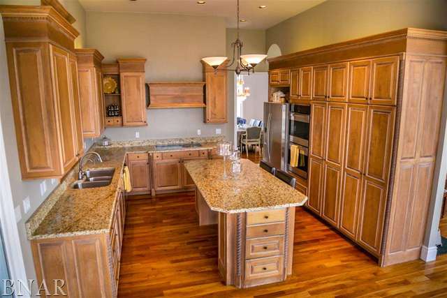 21192 North 500th Road East Benson, IL 61516 - Photo 8 of 30 a kitchen with stainless steel appliances granite countertop a refrigerator and a stove