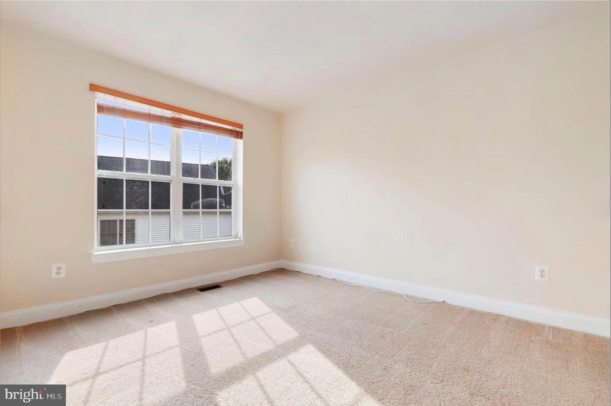 680 Orchard Ridge Drive, Unit 100 Gaithersburg, MD 20878 - Photo 19 of 25 a view of an empty room with a window