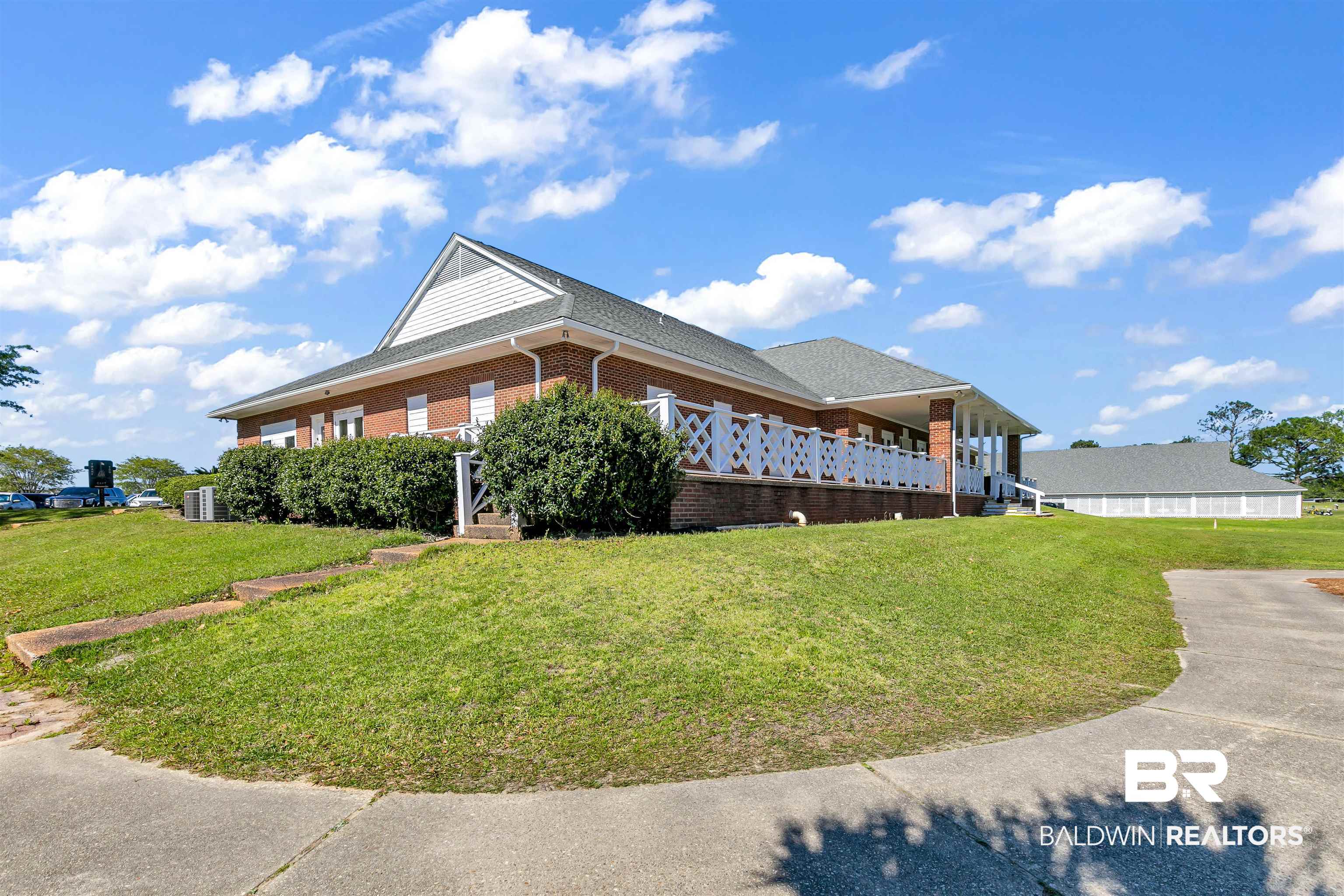 10140 Chipper Lane Foley, AL 36535 - Photo 71 of 72 View of side of home featuring a lawn