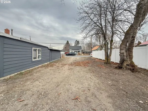 a view of a house with a snow in the yard
