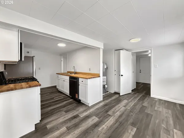a kitchen with a stove and a refrigerator