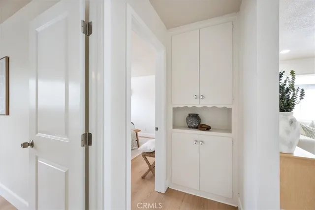 a close view of a utility room with closet dryer and washer