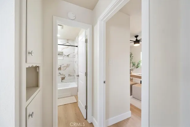 a view of a bathroom from a hallway