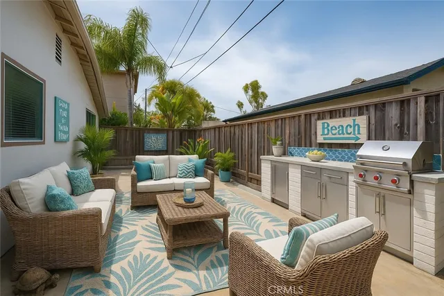 a view of a patio with couches chairs and a potted plant