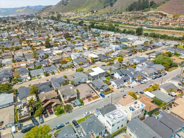 an aerial view of a building with street