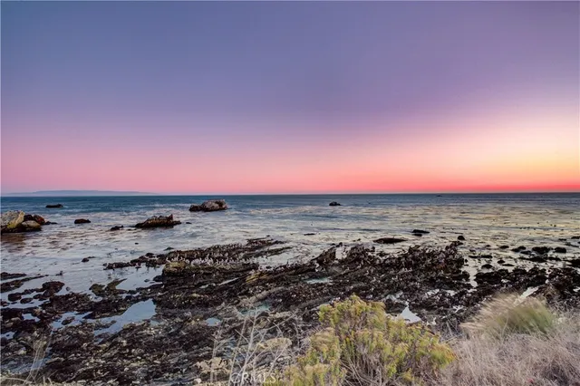 a view of a beach with an ocean