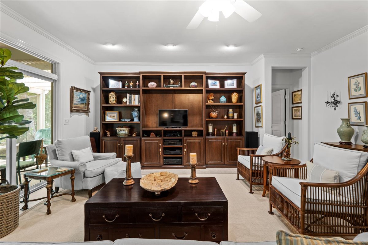 503 Breezeway Lane Georgetown, TX 78633 - Photo 5 of 38 Open and welcoming great room with large windows overlooking the backyard and direct access to the screened-in porch. The layout offers plenty of space for seating while staying connected to the kitchen.