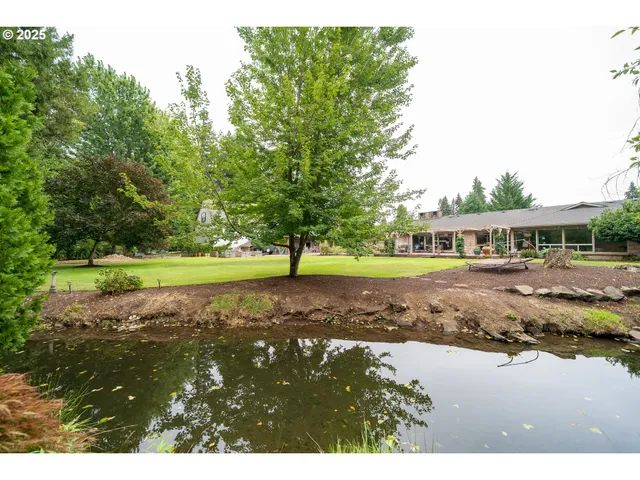 a view of swimming pool with a yard