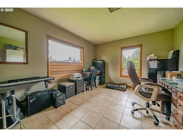a room with gym equipment and large mirror
