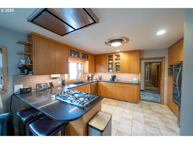 a kitchen with a sink and a refrigerator