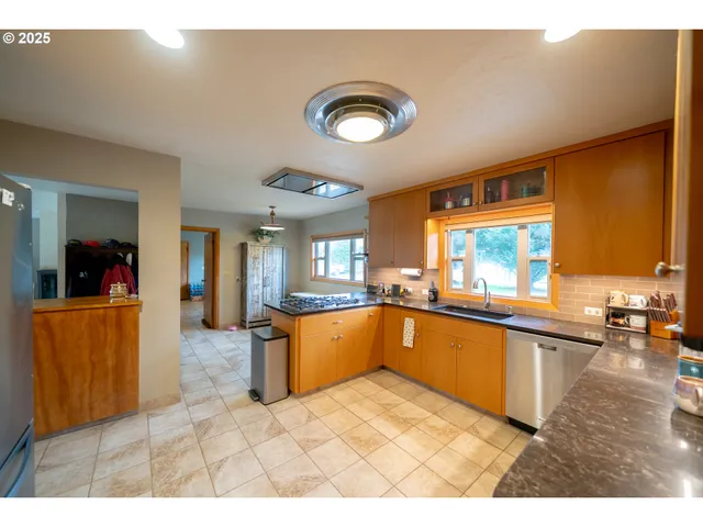 a large kitchen with lots of counter space and appliances