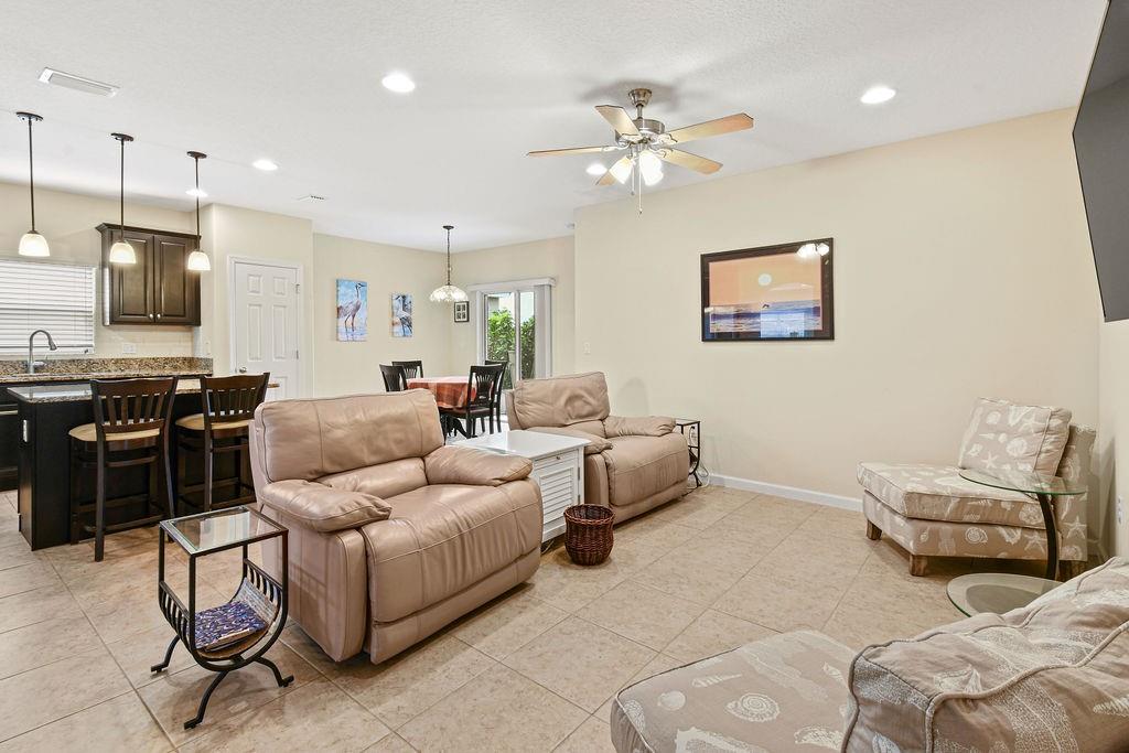 1728 Berkshire Circle Southwest Vero Beach, FL 32968 - Photo 12 of 36 a living room with furniture and kitchen view