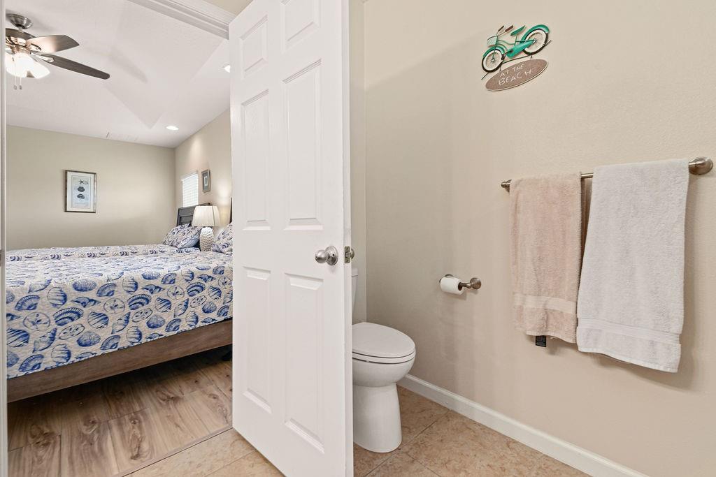 1728 Berkshire Circle Southwest Vero Beach, FL 32968 - Photo 23 of 36 a bedroom with a bed and a couch