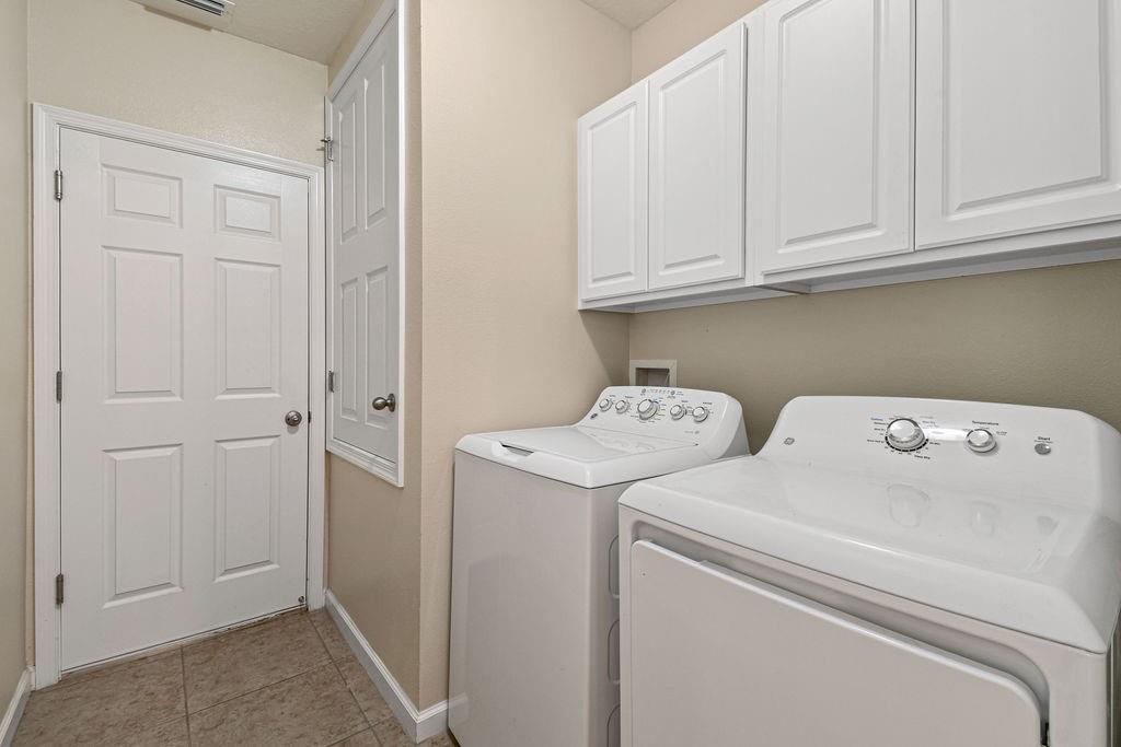 1728 Berkshire Circle Southwest Vero Beach, FL 32968 - Photo 31 of 36 a view of storage and utility room with washer and dryer