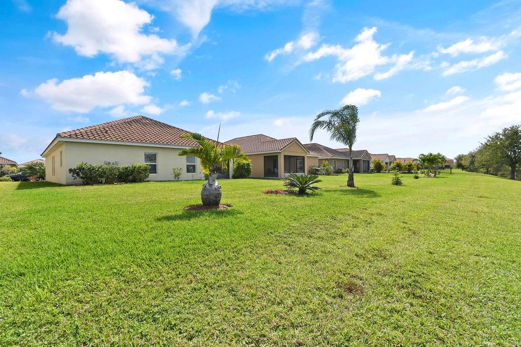 1728 Berkshire Circle Southwest Vero Beach, FL 32968 - Photo 36 of 36 a view of an outdoor space with a garden