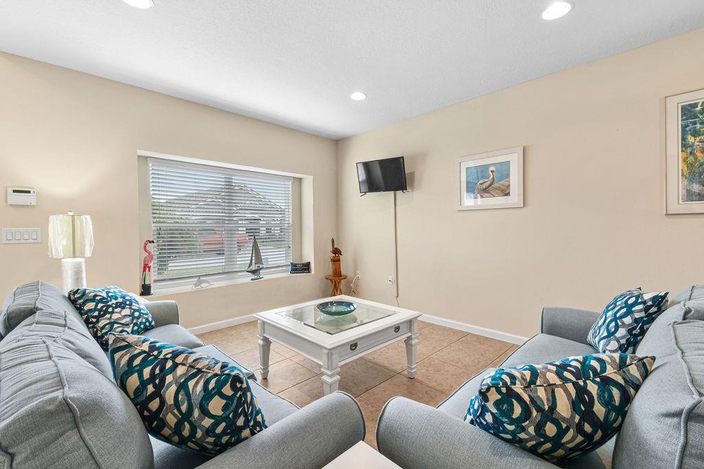 1728 Berkshire Circle Southwest Vero Beach, FL 32968 - Photo 5 of 36 a living room with furniture and a large window