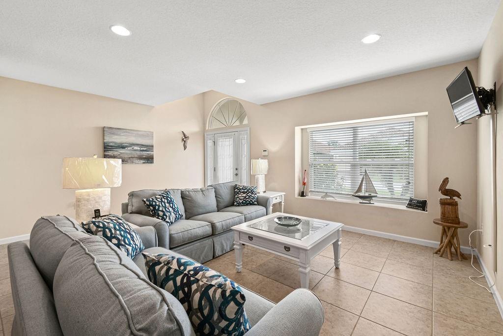 1728 Berkshire Circle Southwest Vero Beach, FL 32968 - Photo 6 of 36 a living room with furniture and a large window