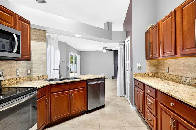 a kitchen with a sink stove and cabinets