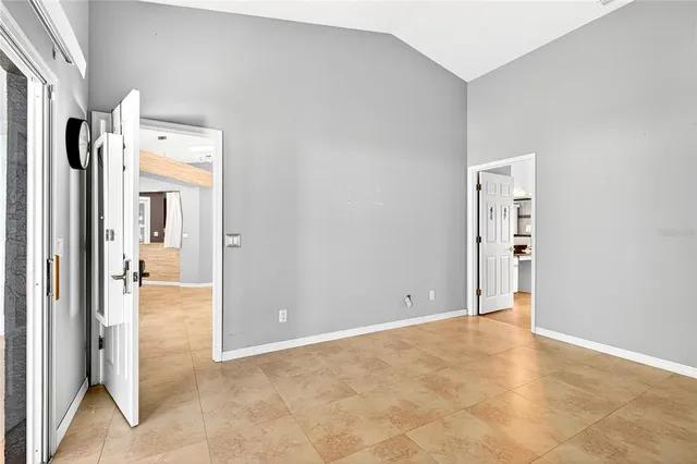 an empty room with a bathroom and a sink