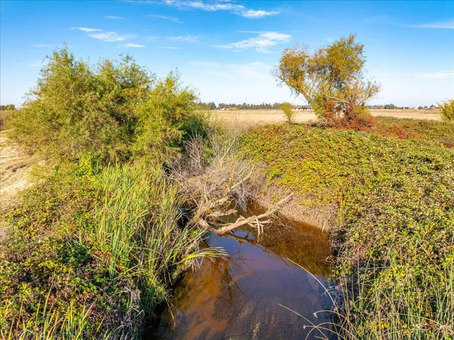 a view of a lake with a yard